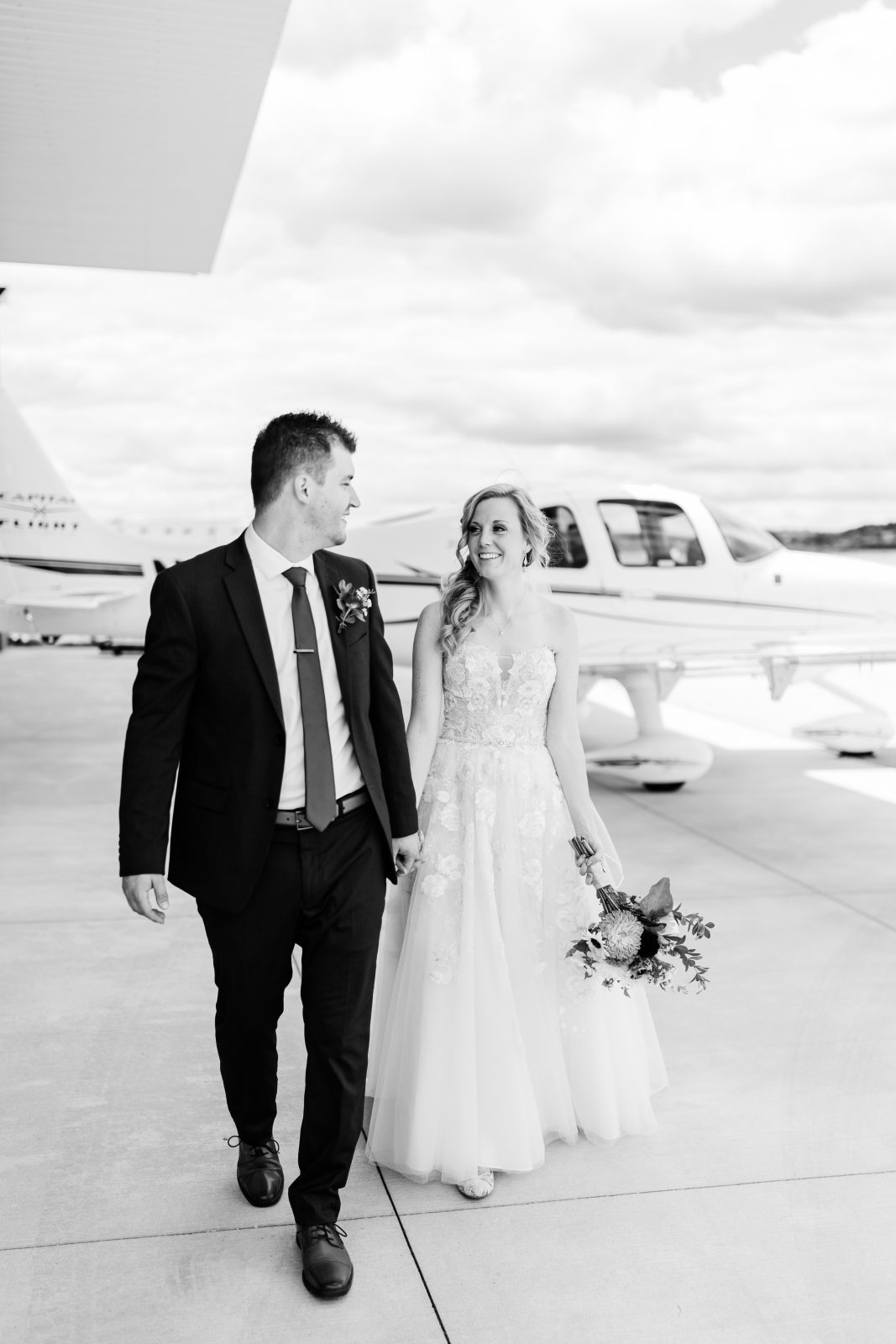 Bride and Groom Airplane Hangar Wedding Photos