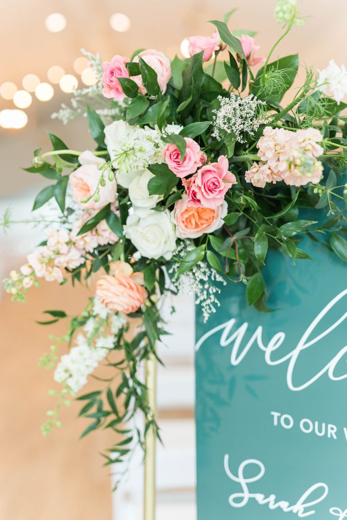 emerald green spring wedding flowers welcome sign