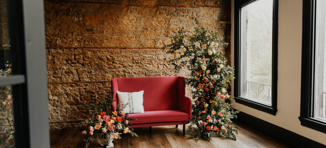 pink couch with floral installation ellsworth block madison capitol weddings